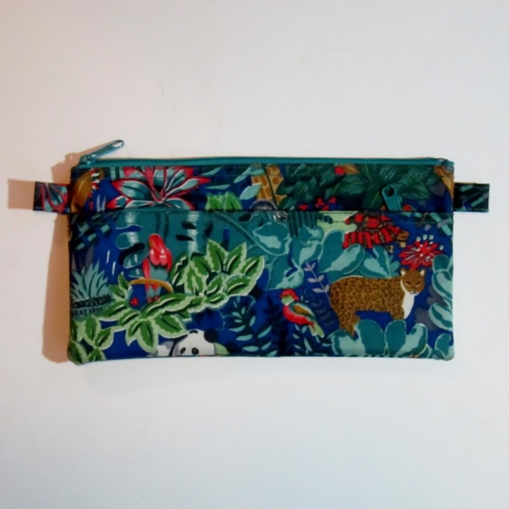 Clutch bag with jungle designs, 8-1/2 inches wide.
